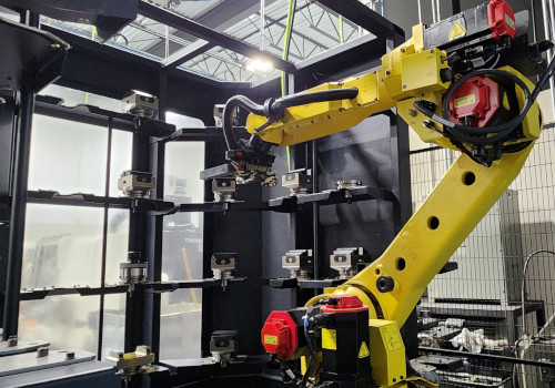FANUC robot with pallet rack supporting automated 5-axis production